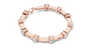 Rose gold diamond chain bracelet with five round solitaire diamonds along the band.
