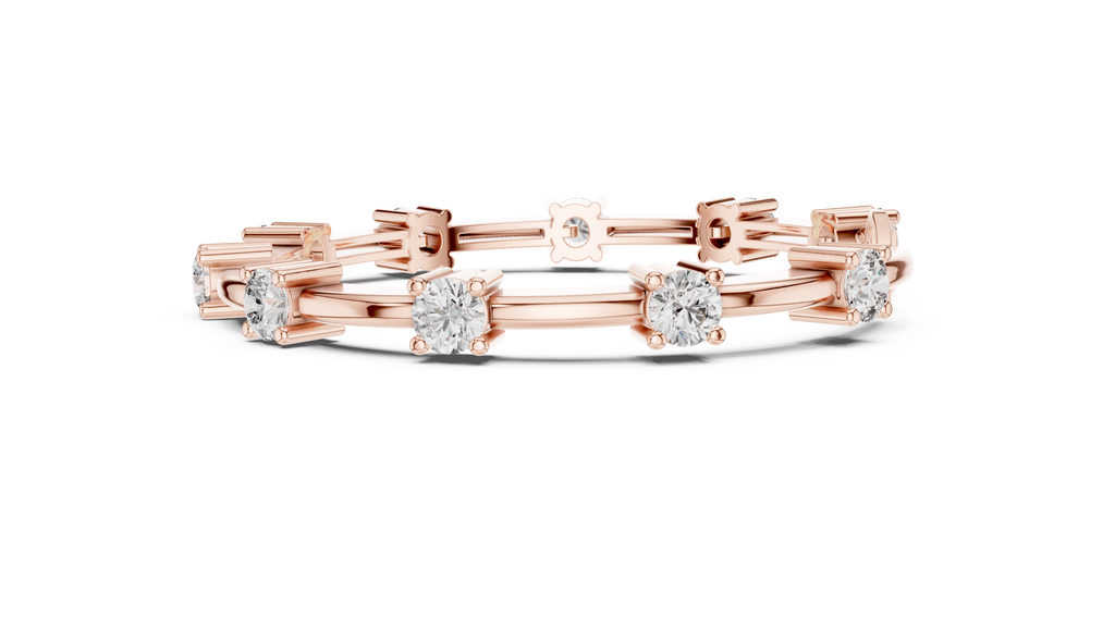 Rose gold diamond chain bracelet featuring five round solitaire diamonds on the links.