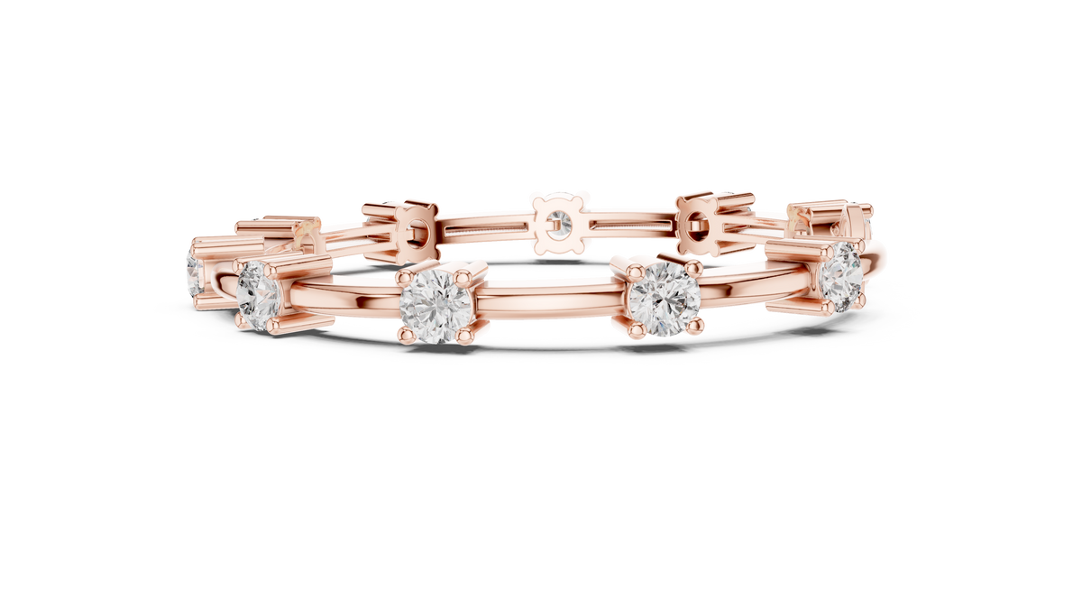 Rose gold diamond chain bracelet featuring five round solitaire diamonds on the links.