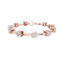 Diamond chain bracelet in rose gold with five round solitaire diamonds.