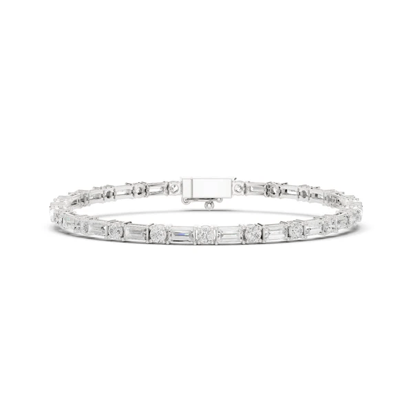 White gold diamond bracelet with mixed-cut stones and rectangular clasp center bar.