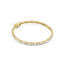 Yellow gold diamond bracelet with baguette-cut stones in a slim tennis-style setting