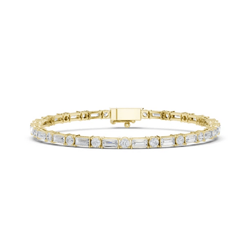 Two-tone diamond bracelet with yellow gold frame and mixed-cut stones in bezels.