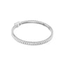 White gold baguette diamond tennis bracelet with rectangular diamond settings, oval profile.