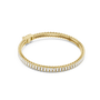 Gold-tone tennis bracelet with baguette-cut diamond stations along a hinged frame