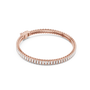 Rose gold baguette diamond tennis bracelet with rectangular diamond settings, oval profile.