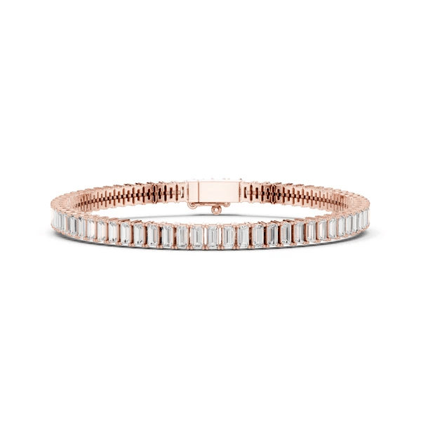 Rose gold-tone tennis bracelet with baguette-cut diamond stations and clasp