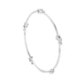 White gold diamond bangle with prong-set round stones, hinged cuff