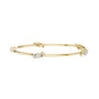 Yellow gold diamond bangle with round center stone and small side diamond accents