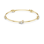 Yellow gold diamond bangle with round center stone and side diamond clusters