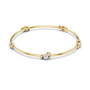 Yellow gold diamond bangle with round center stone and linked diamond accents