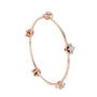 Rose gold diamond floral bangle with round flower clusters at the band joints