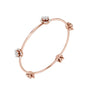 Rose gold diamond floral bangle with four round flower clusters along the curve