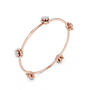 Rose gold diamond floral bangle with four round flower clusters along the curve