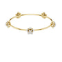 Yellow gold floral diamond bangle with central flower and knotted side mounts