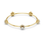Yellow gold floral diamond bangle with central flower, knotted corners, and round diamonds