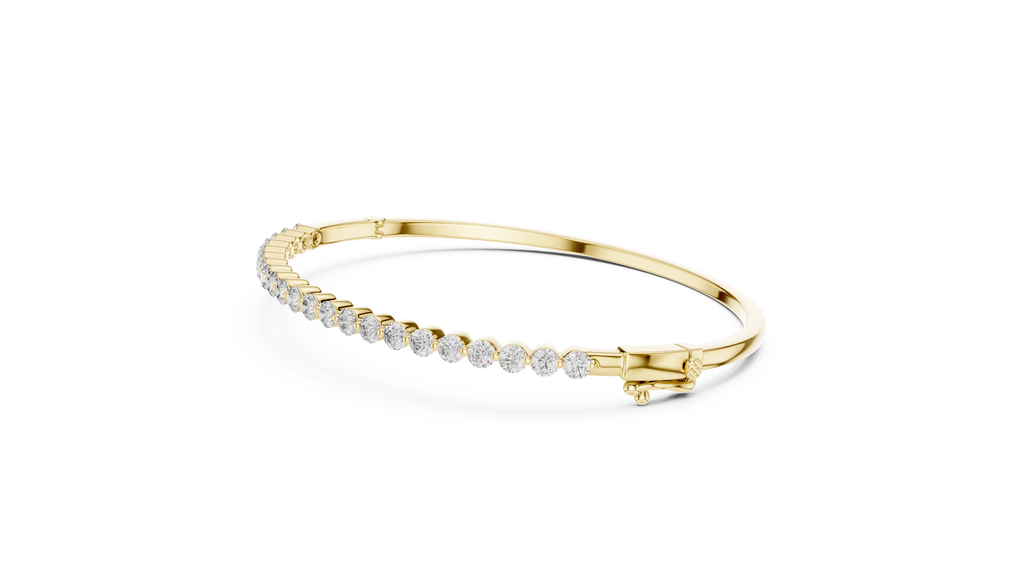 Yellow gold diamond bangle with round pavé diamonds along the inner edge