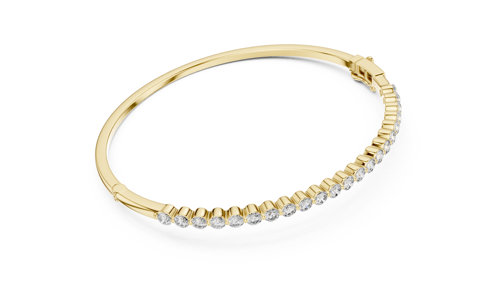 Yellow gold diamond bangle with round pavé diamonds across the band
