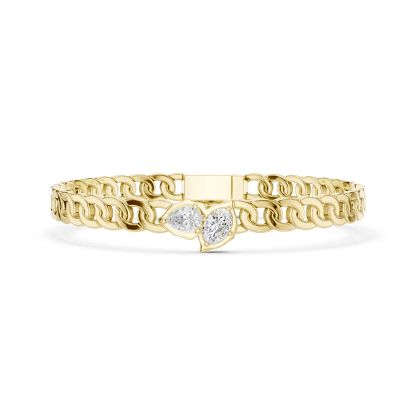 Yellow gold curb link bracelet with heart-shaped diamond centerpiece