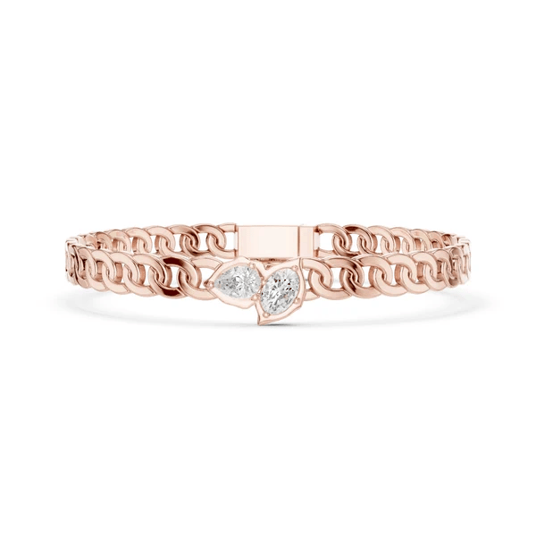 Rose gold curb link bracelet with heart-shaped diamond center cluster