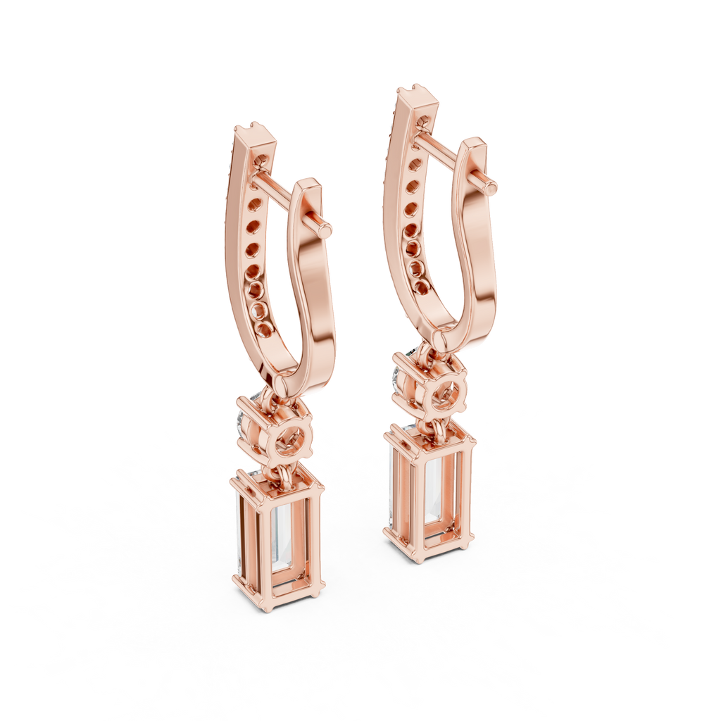 Rose gold hoop earrings with pavé accents and baguette-style stone drop