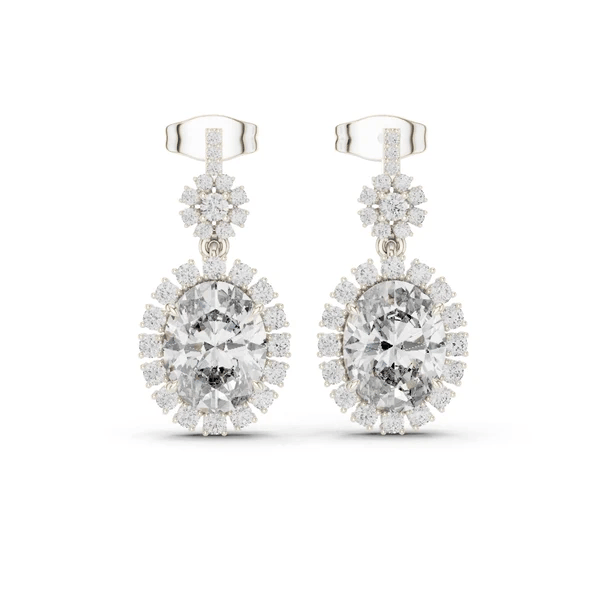 White gold-tone drop earrings with round halo center stone and pavé dangling clusters