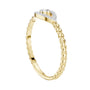 Gold diamond evil eye ring with round center stone and pavé eye motif on braided band