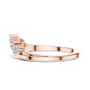 Rose gold curved diamond wedding band with round stones and stepped prong settings