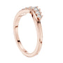 Rose gold curved round-diamond wedding band, side view with stacked prong settings