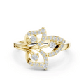 Yellow gold fleur diamond ring with round center stone and pavé accents on band.