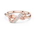 Rose gold infinity knot ring with diagonal pavé stone row and twisted knot band