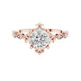 Rose gold engagement ring with round center diamond and sculpted crown setting