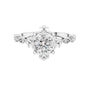 White gold engagement ring with round center diamond and sculpted crown setting