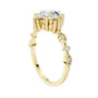 Yellow gold engagement ring with round center diamond and oval side stone clusters