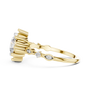 Yellow gold engagement ring side view with round diamonds on the split shank