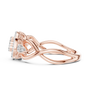 Rose gold engagement ring with intertwined bands and pavé detail around the head