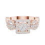Rose gold ring with square halo centerpiece and clear gemstone cluster, front view