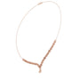 Rose gold diamond drop necklace angled view; round stones lead to teardrop pendant