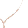 Rose gold V-shape diamond drop necklace close view of round stones and teardrop pendant