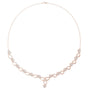 Rose gold necklace with round link row and blue accent stones, teardrop centerpiece pendant