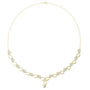 Yellow gold necklace with round link row and blue accent stones, teardrop center pendant