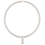 Rose gold emerald-cut diamond pendant on a line of baguette diamonds and prongs