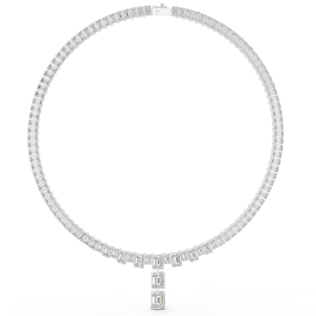 Emerald-cut diamond line necklace in white gold with baguette diamonds along the chain