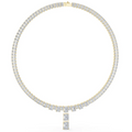 Emerald-cut diamond line necklace with yellow gold clasp and baguette link chain