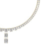 Diamond line necklace with emerald-cut baguette stones and a dangling emerald-cut pendant in yellow gold.