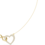 Yellow gold diamond heart love knot necklace detail with heart drop charm