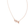 Rose gold LOVE script necklace pendant detail with round diamond accents