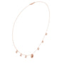 Diamond pendant necklace with baguette center stone and star accents, rose gold