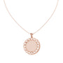 Round diamond medallion pendant on rose gold chain with circular filigree frame