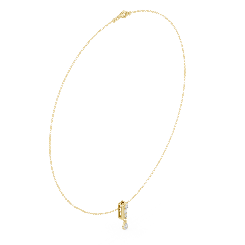 Yellow gold pear diamond pendant necklace, close-up of teardrop center stone